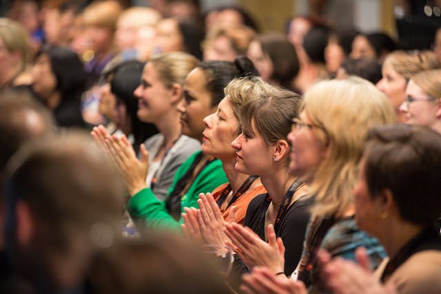 women in the audience at a conference