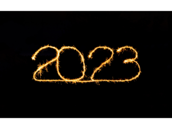 Simple photo image of gold twine on black background, spelling out the number, 2023.